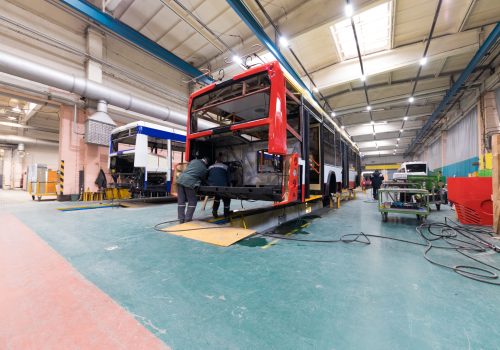 One working day of modern automatic bus manufacturing with unfinished cars workers in protective uniform automotive parts background SSUCv3H4sIAAAAAAAEAI1TwY7bIBC9V+o/RD4nkjFgTK899dBbb6sesCEJWmwiwNtuo/x7wcTxOIqye/O89xjPvJk5f/2y2RSt8Lorvm3OKYqxNmb0wYmg7RDhcnvFldTBOi1MBFHCLhNT+CDC6JUHKVCF3T7GeH4rjOjfIdDqgw+2ez0dbbCQ6Kyxo2vtXwhKp0Tvg+4VRHvrw/Q+/RotaCpcGdWrIXioP9lBUij1xzEE5aZCoPBNS2VbE9HV+3/WDsLddd+JoA7RllX/s6UvOd7MRO5QhEgVPwaZbE5+bgHrxzaxP7XvlDFiUHb0xcxftk8S/nJi8CfrQp7cg6TfhQO58sfv24gOaujSjM4X0J6LRoo83JcsLV7/RM/6qd2raPILxGKU2gI73mwnzGQlyHxyutPDATyz4agciLvoj+0BMNgwVVLk5goZvU8hwqgpMaeM8pLWMcDFvJpxhlrCWvO2HnWk3DuocTwZK6SSCwQ3hlZlzcuGsZur6528CnhVLoL7Fc8aRGmzaO428Cqpy3qRzLeUuYo1fOHms0IU45o2VQPera+DYopZyRhdBMs6zyTIvD6BWcERzH93Z0lEcHSJZM3ldmZj2+vY5tpbeOif8pchFkVPvWMVrtEHI2BVzTh/7C8jpKL4sb+MoIahZw4RTDirP3CIV4g3+OoQOAed3Cn2TcdKovY7grDYkbaqd6JF3Y6WTHBJWly3dbzgy3+SJVyVugUAAA==